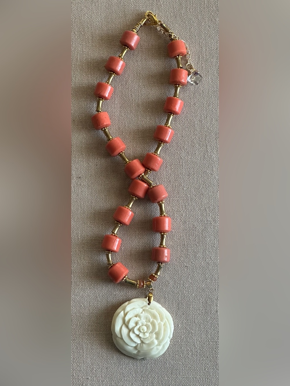 22 inch Coral Bead Necklace with White Floral Pendant and Gold Accents